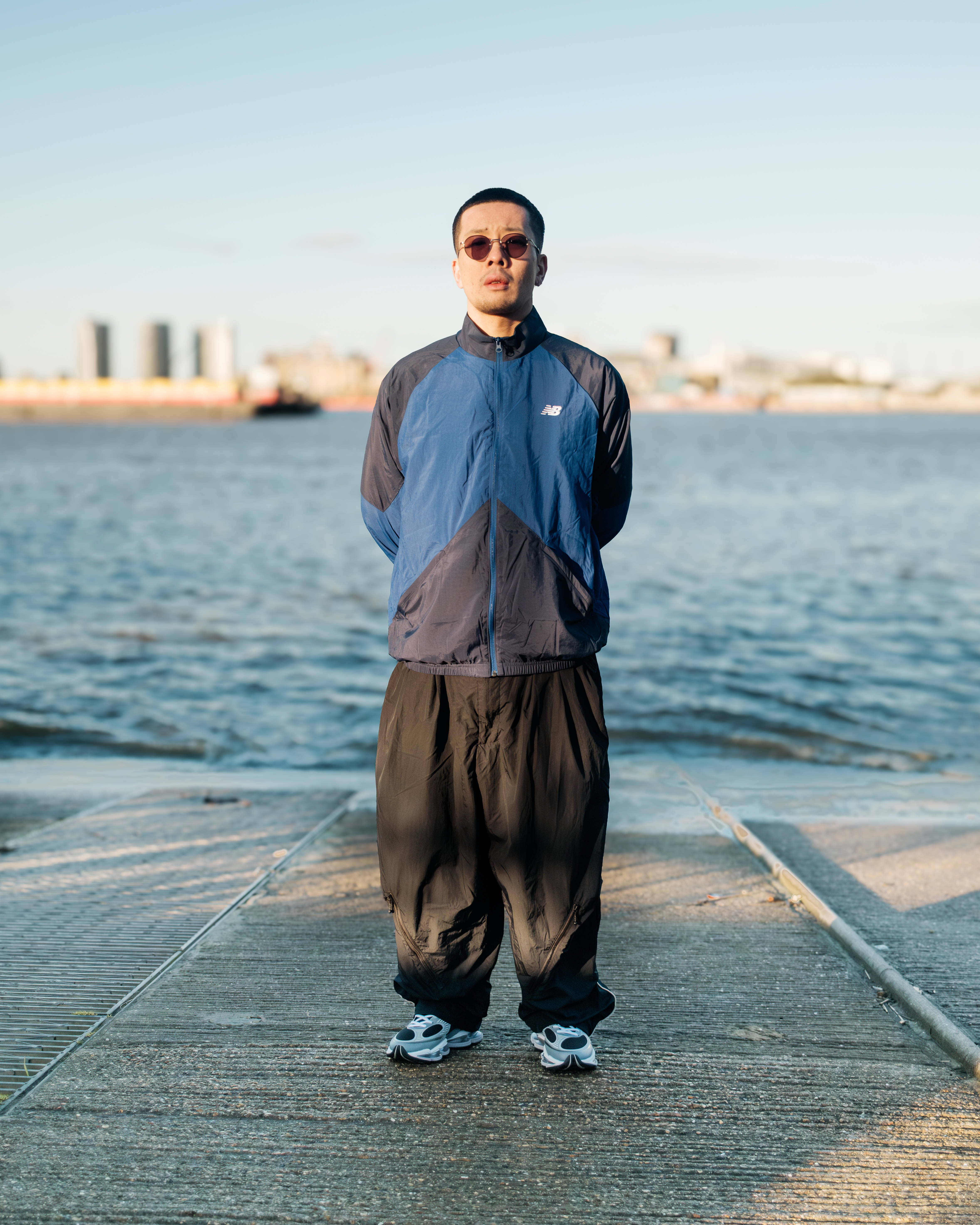new balance abzorb 2000 worn by geoffrey in tracksuit with thames river backdrop