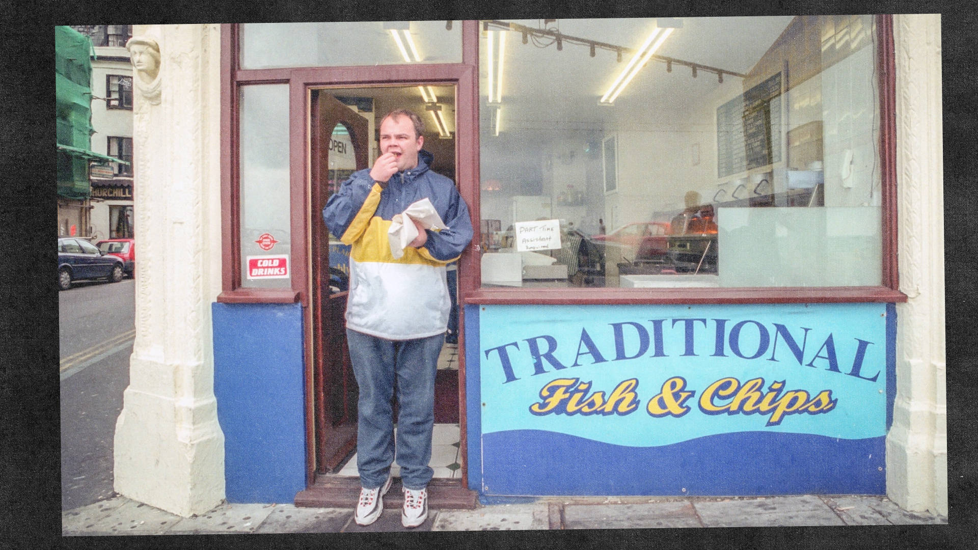 Skint records owner eating fish and chips in Brighton uk wearing comet red air max 95