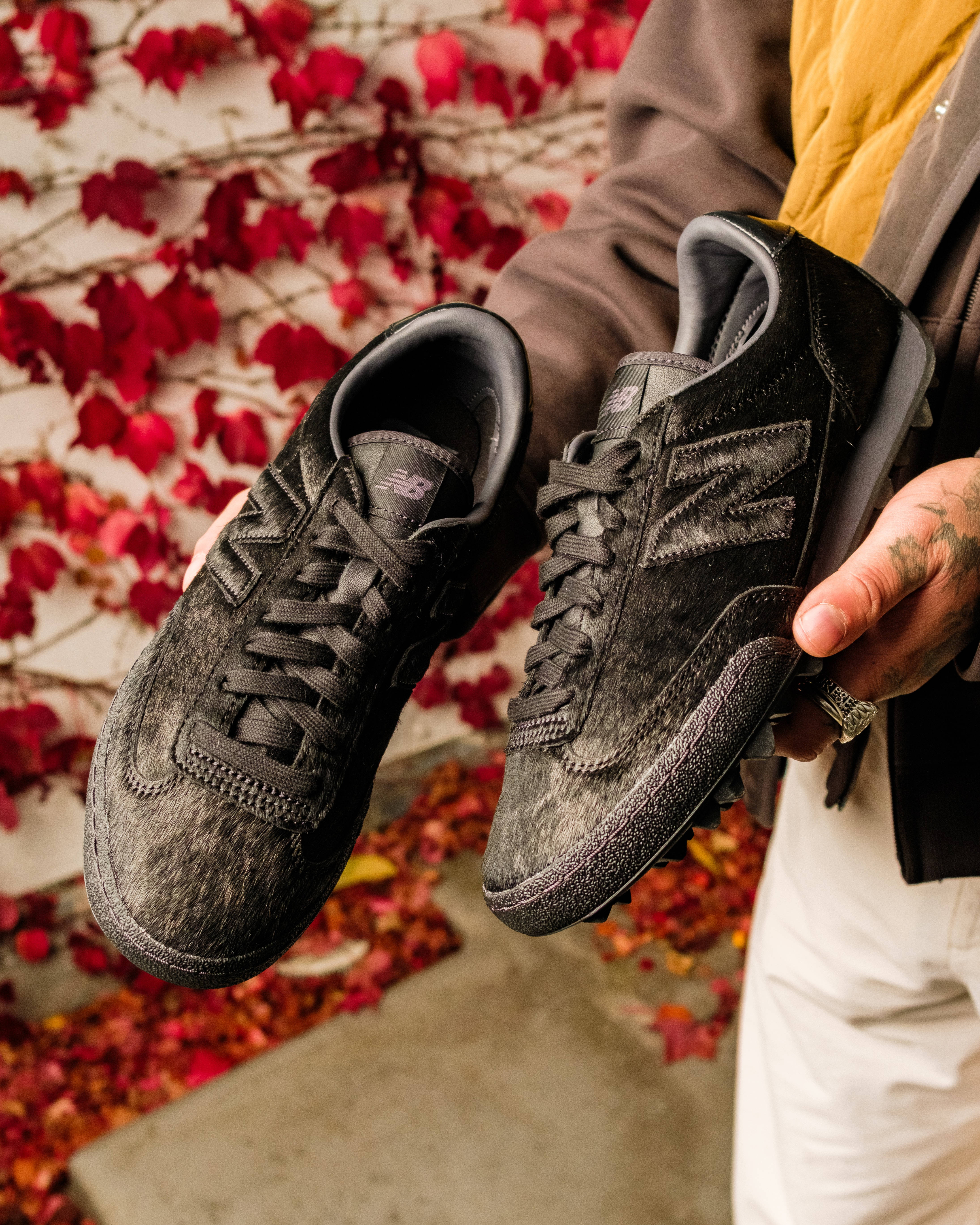 new balance gator run black pony hair in hand shots editorial
