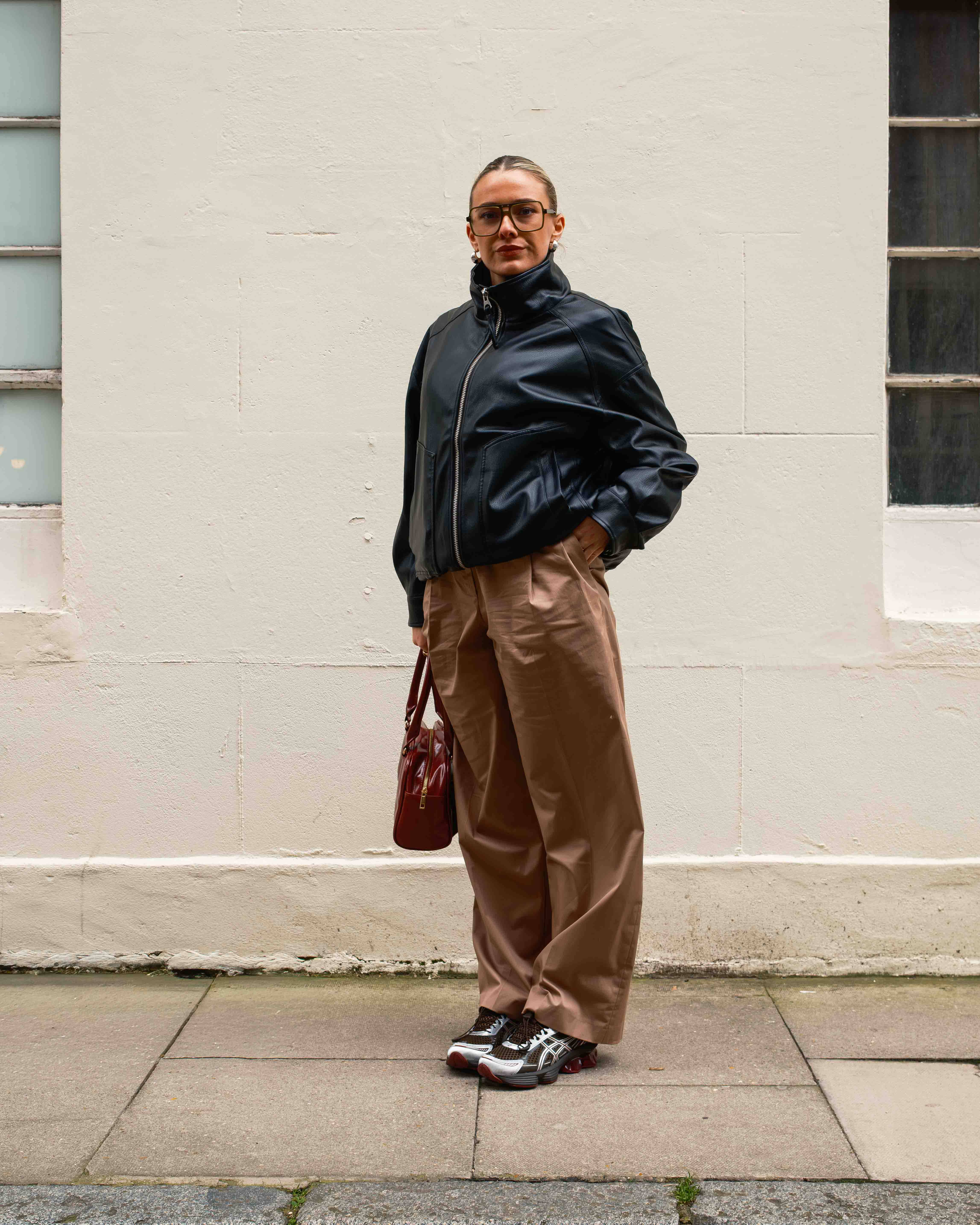 asics gel kinetic styled against urban backdrop editorial