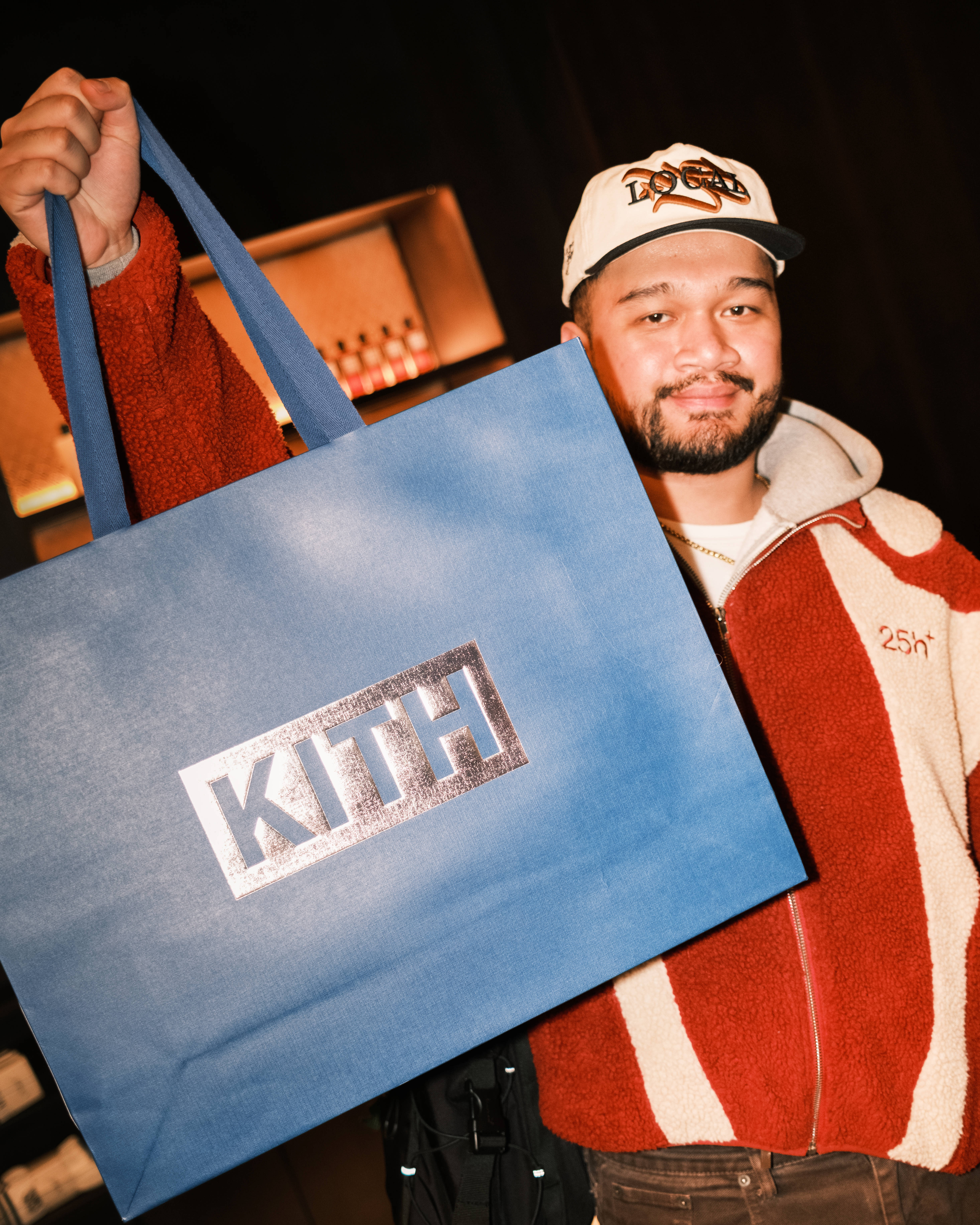 Kith London Store opening press day holding premium blue Kith paper bag 