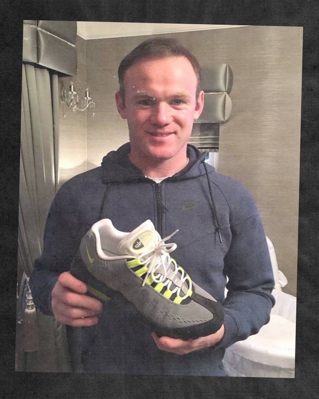 Wayne Rooney holding the Air Max 95 EM OG Neon