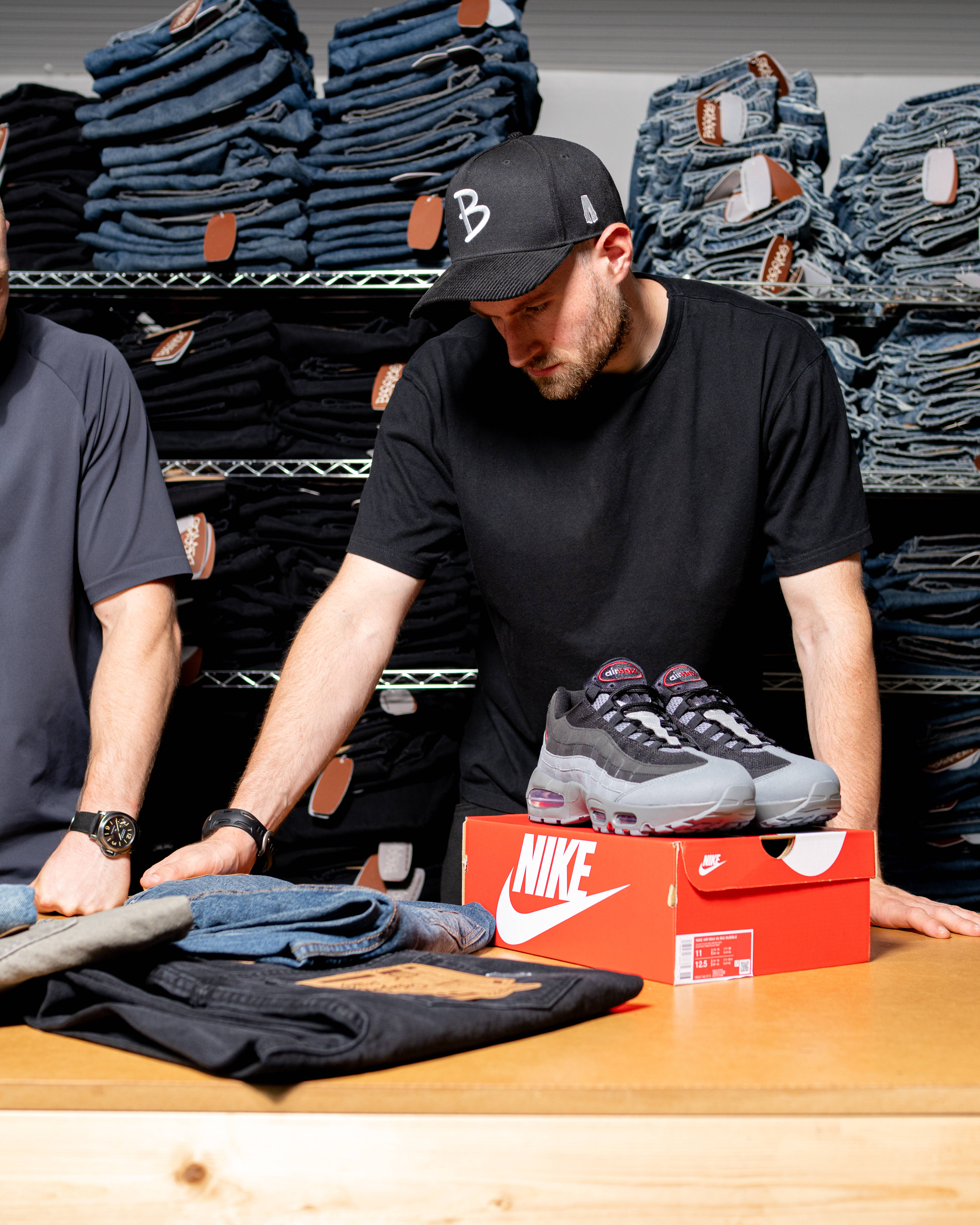 baggys tv's sam in the cut studying the denim game on cutting table