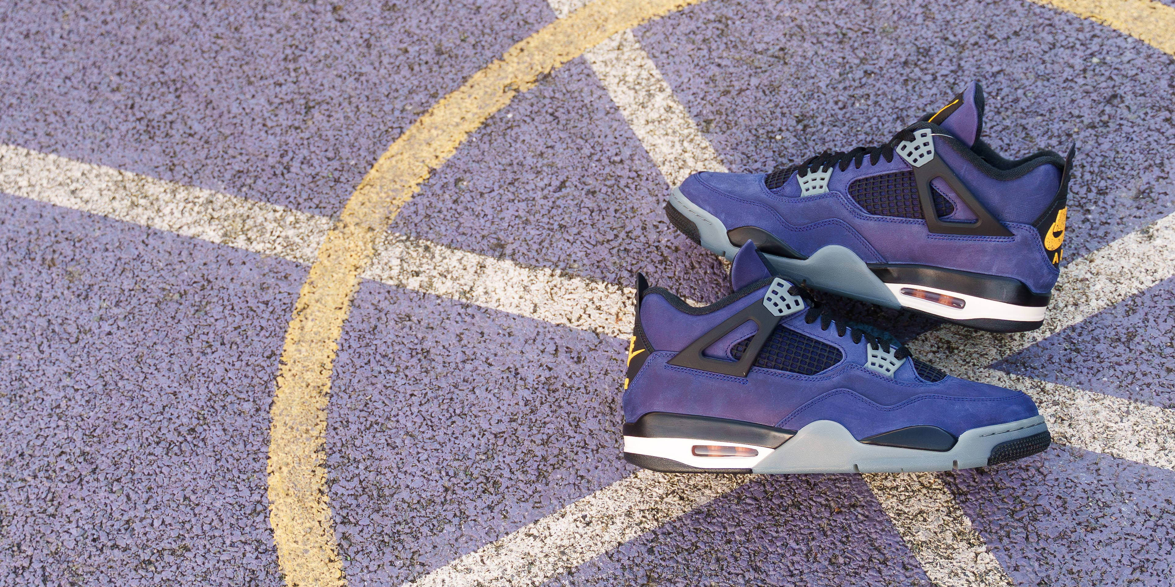 aj4 imperial purple laid flat on court backdrop