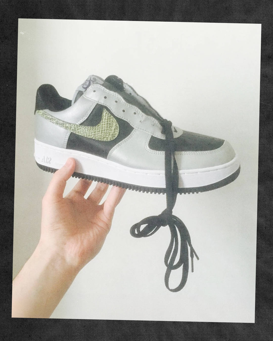 gary warnett holding up snakeskin air force 1 retro