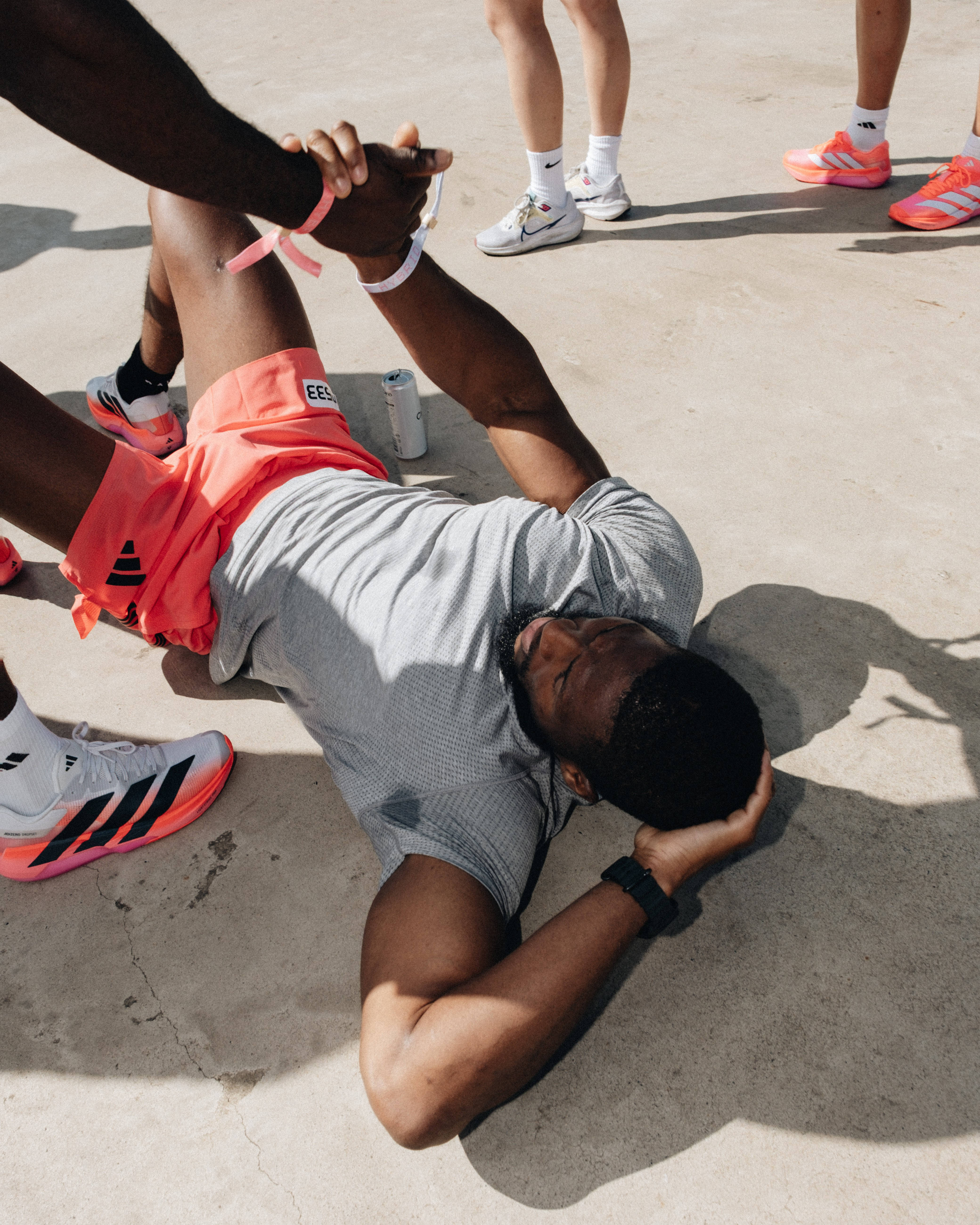 guy restin post exercise lying on floor at adidas activation
