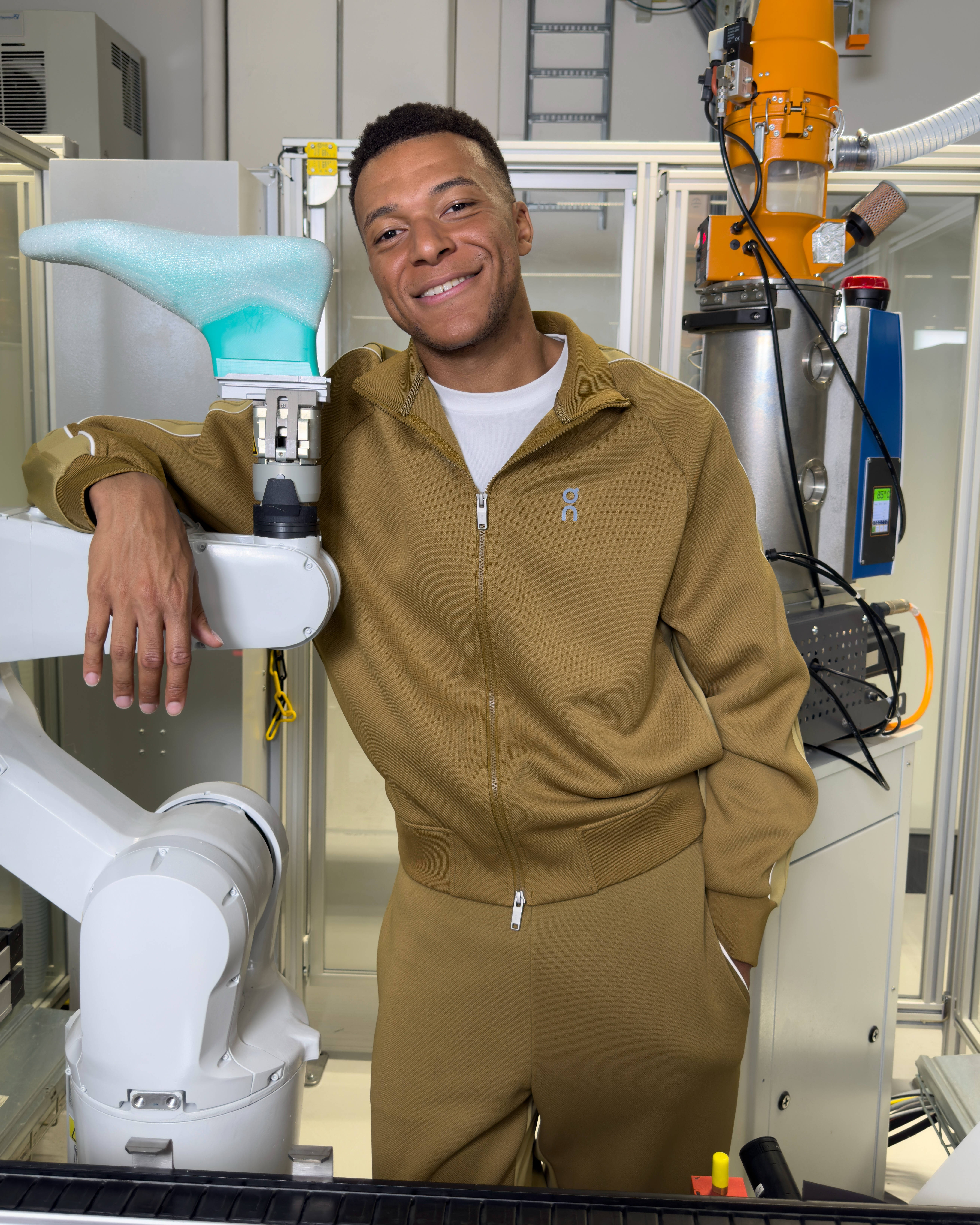 kylian Mbappe at On running studio