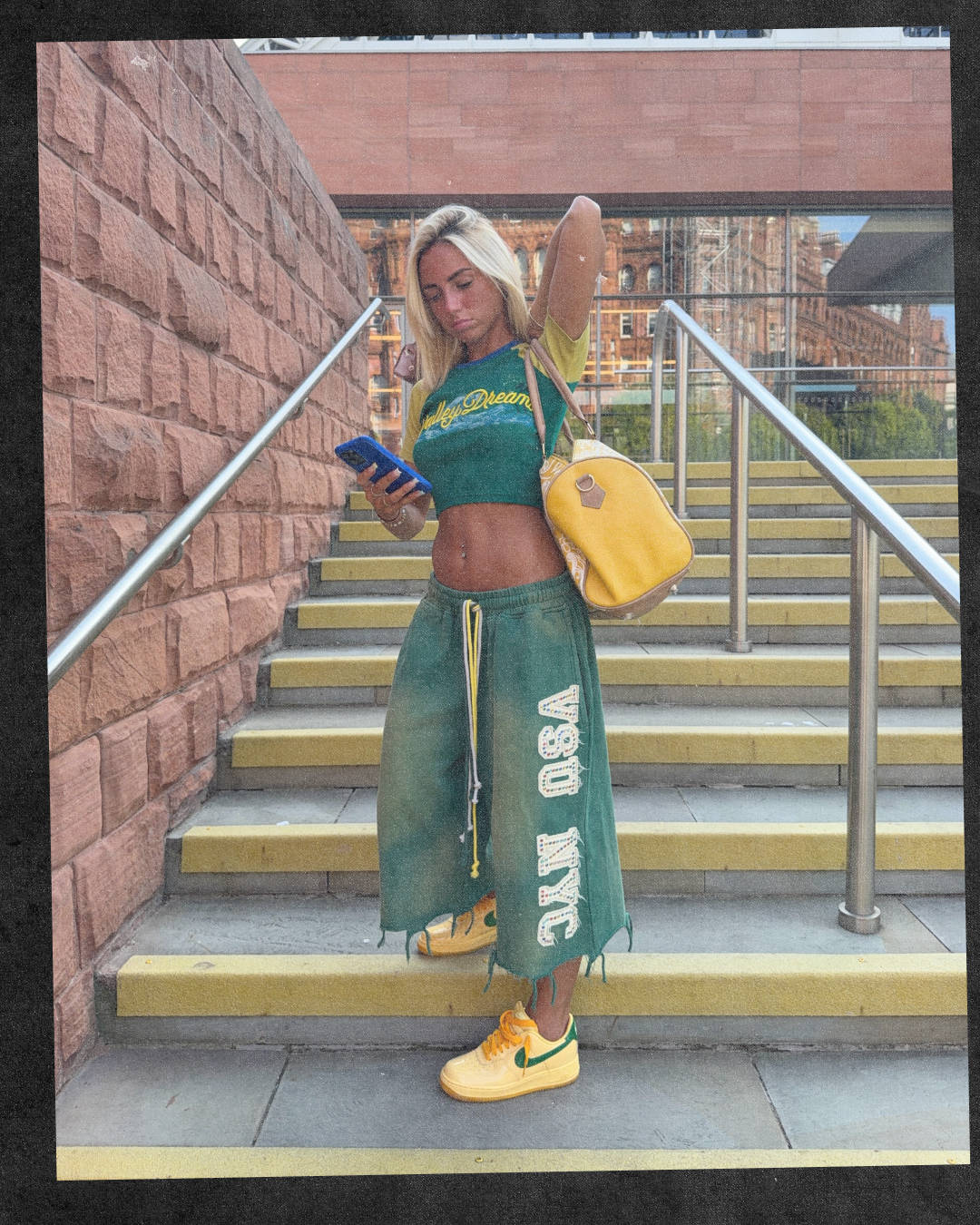 streetwear girly in crop top and long cotton bottom shorts wearing matching peach yellow air force 1s