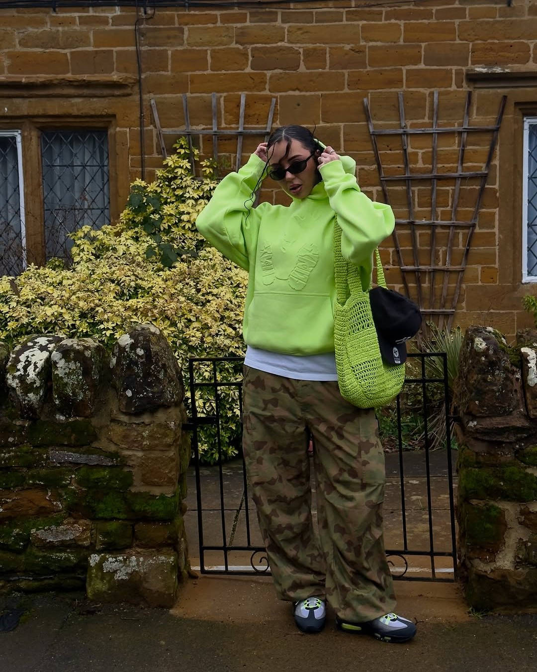 air max 95 neon styled with neon hoodie and camo pants
