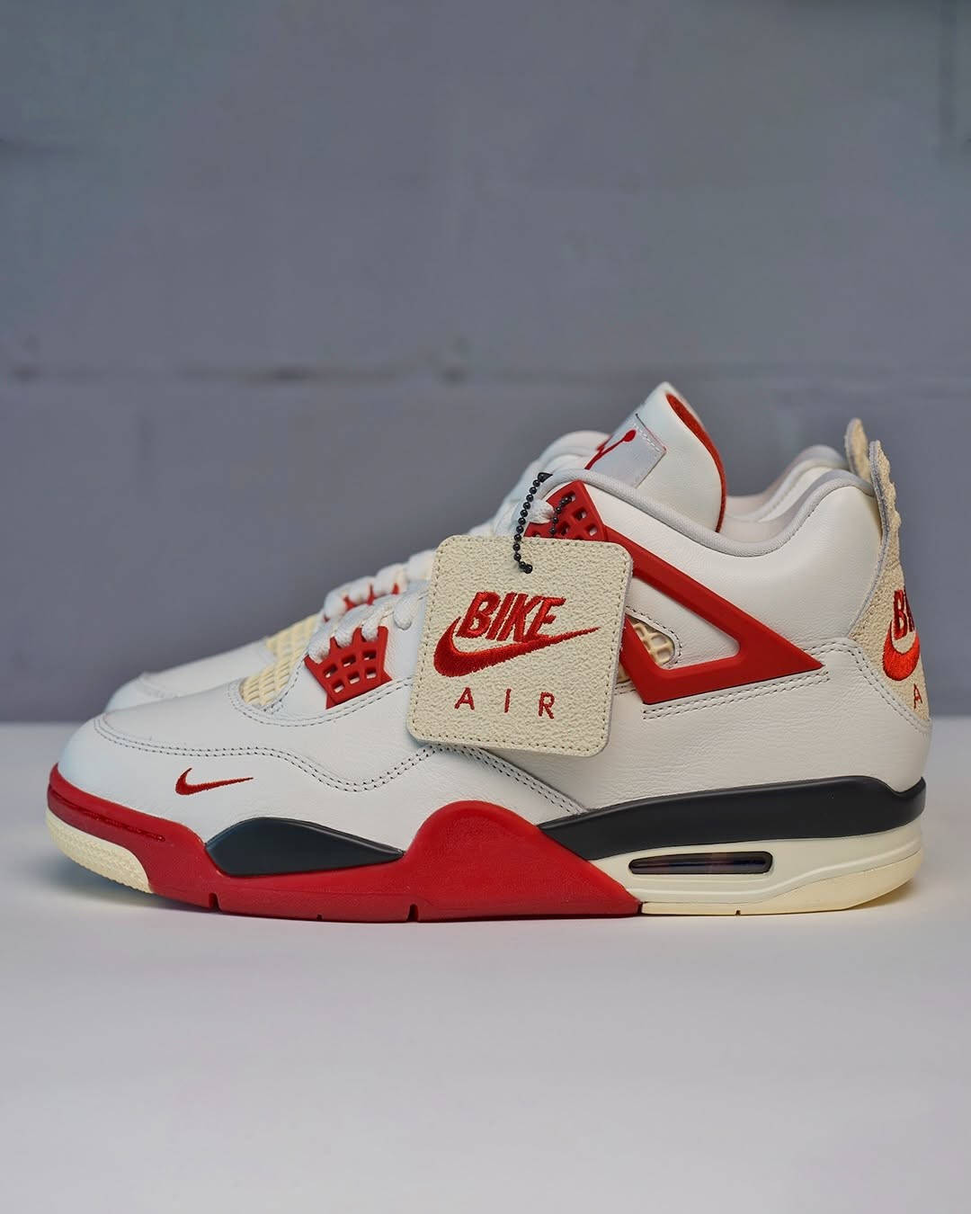 Nigel Sylvester x Air Jordan 4 Sail Cinnabar