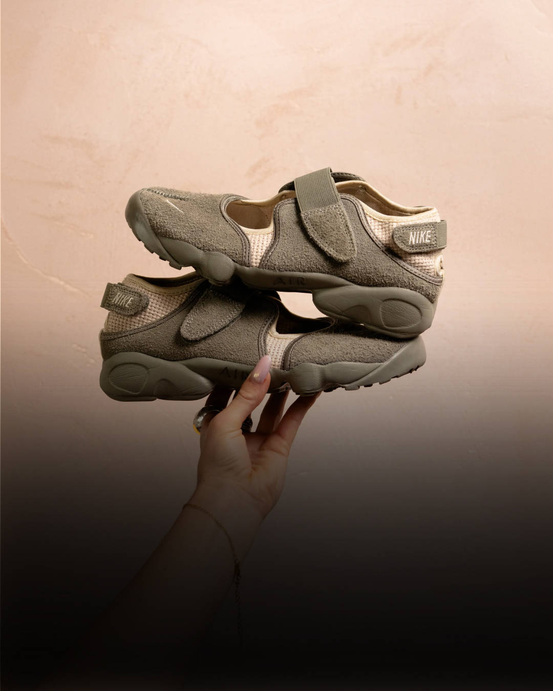 Nike air rift up close pair shot showing texture next to netted jumper