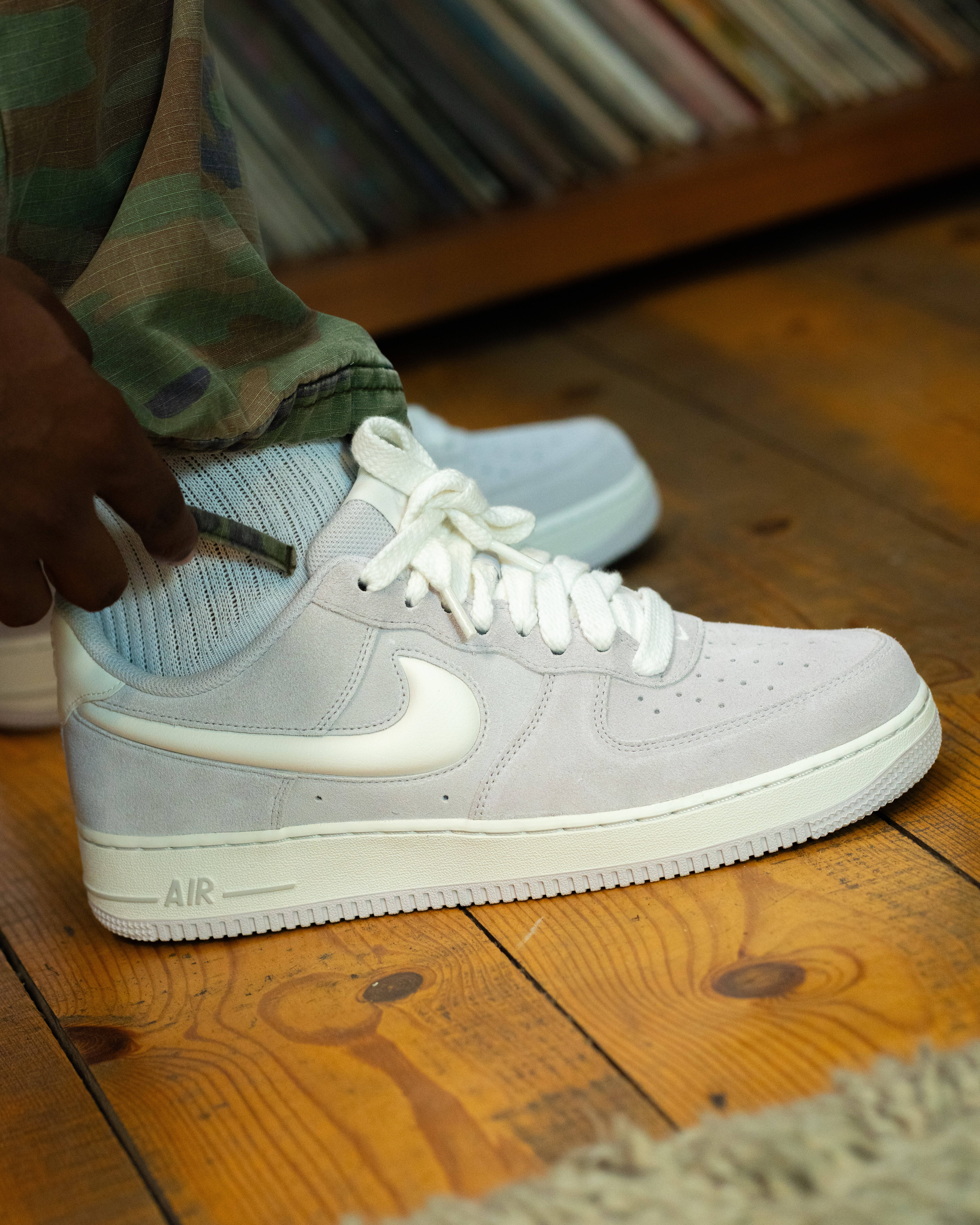 air force 1 side on cream colourway with wooden flooring an vinyl backdrop