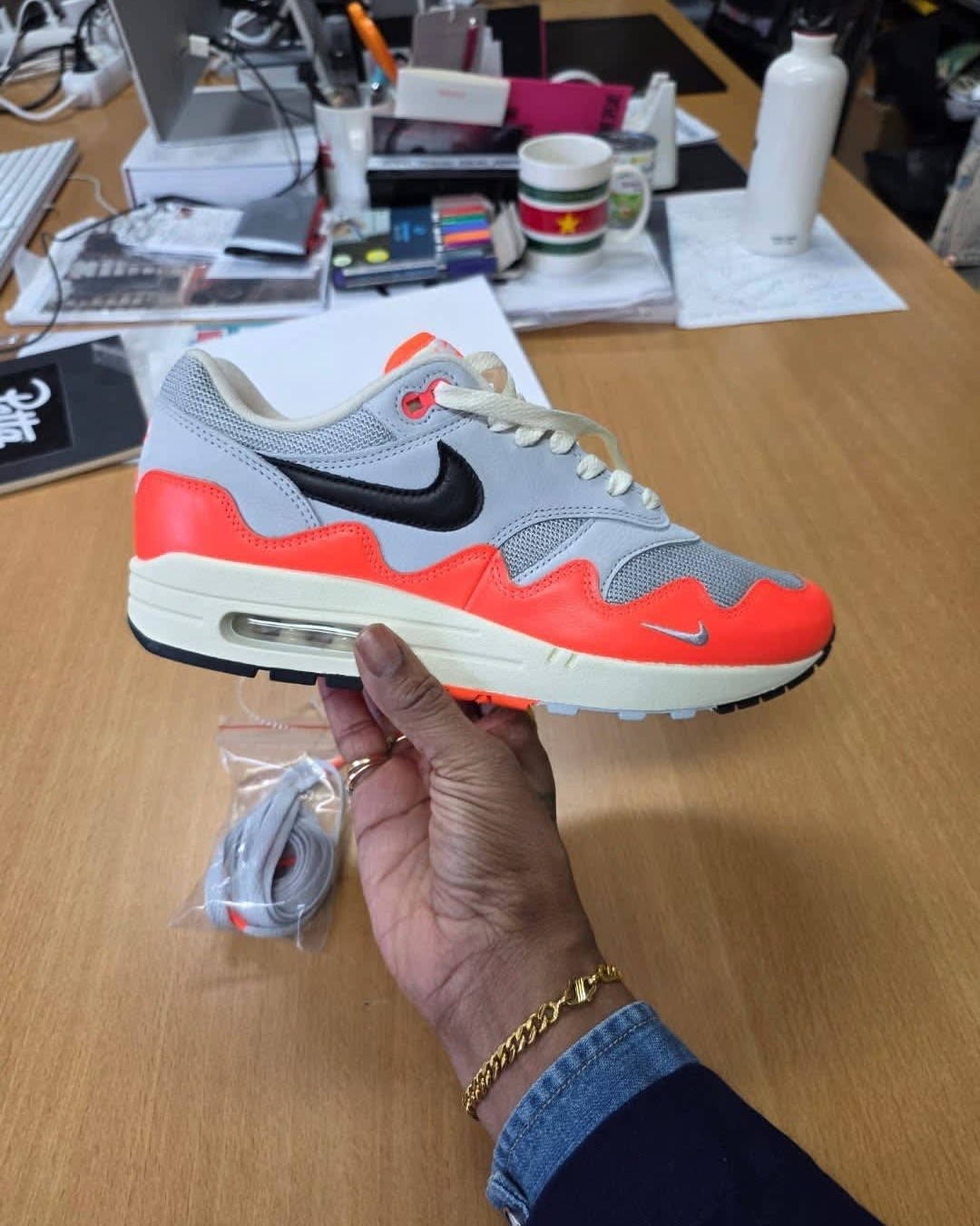 Patta x Nike Air Max 1 White Crimson in-hand look