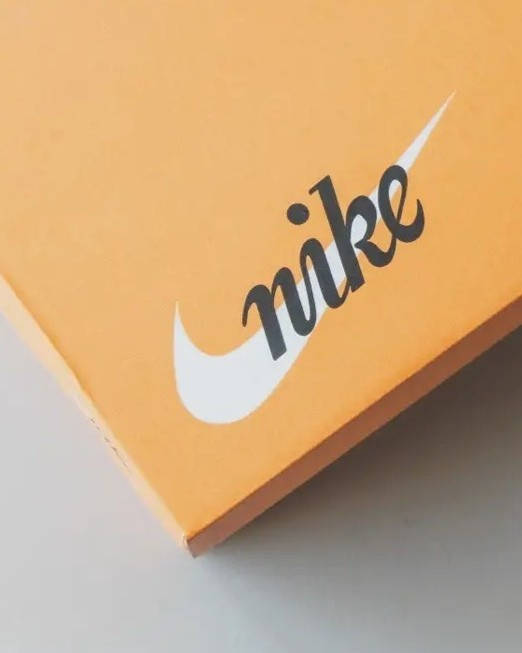 history of Nike orange box script logo