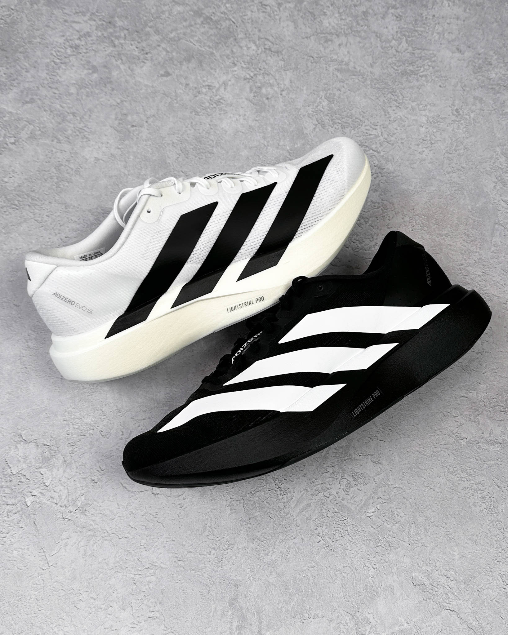 adidas evo sl white and black colourways flat lays