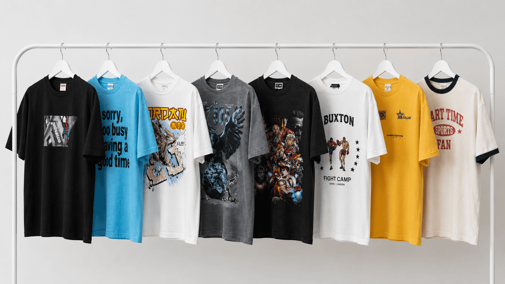 A selection of graphic tees hanging together