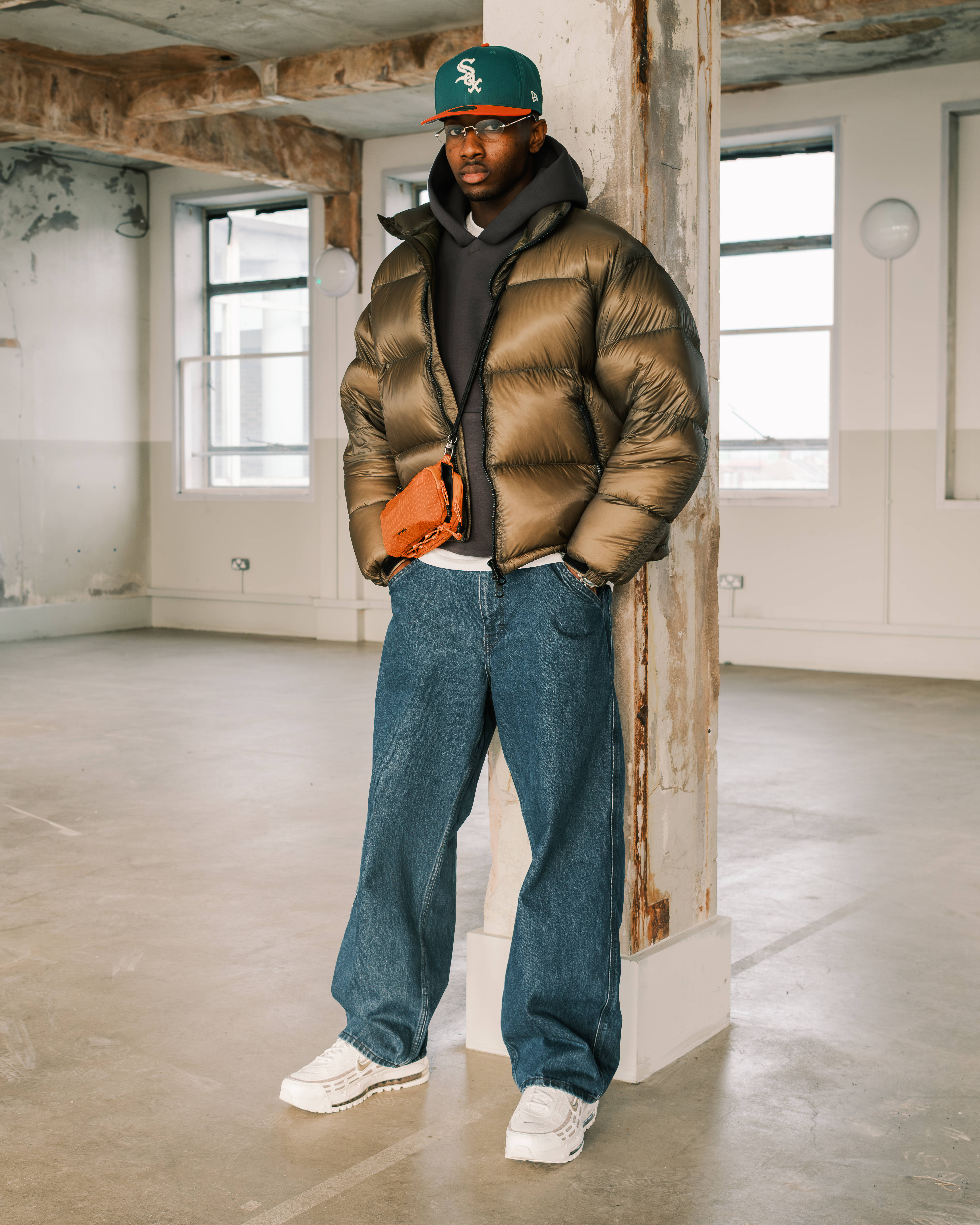 nike air max tl 2.5 techwear styled with industrial editorial backdrop