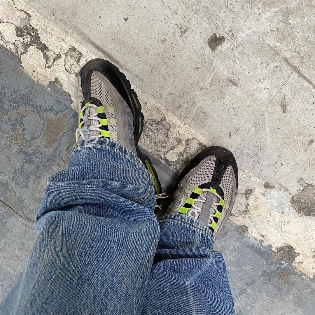 neon 110s paired with denim on foot shot