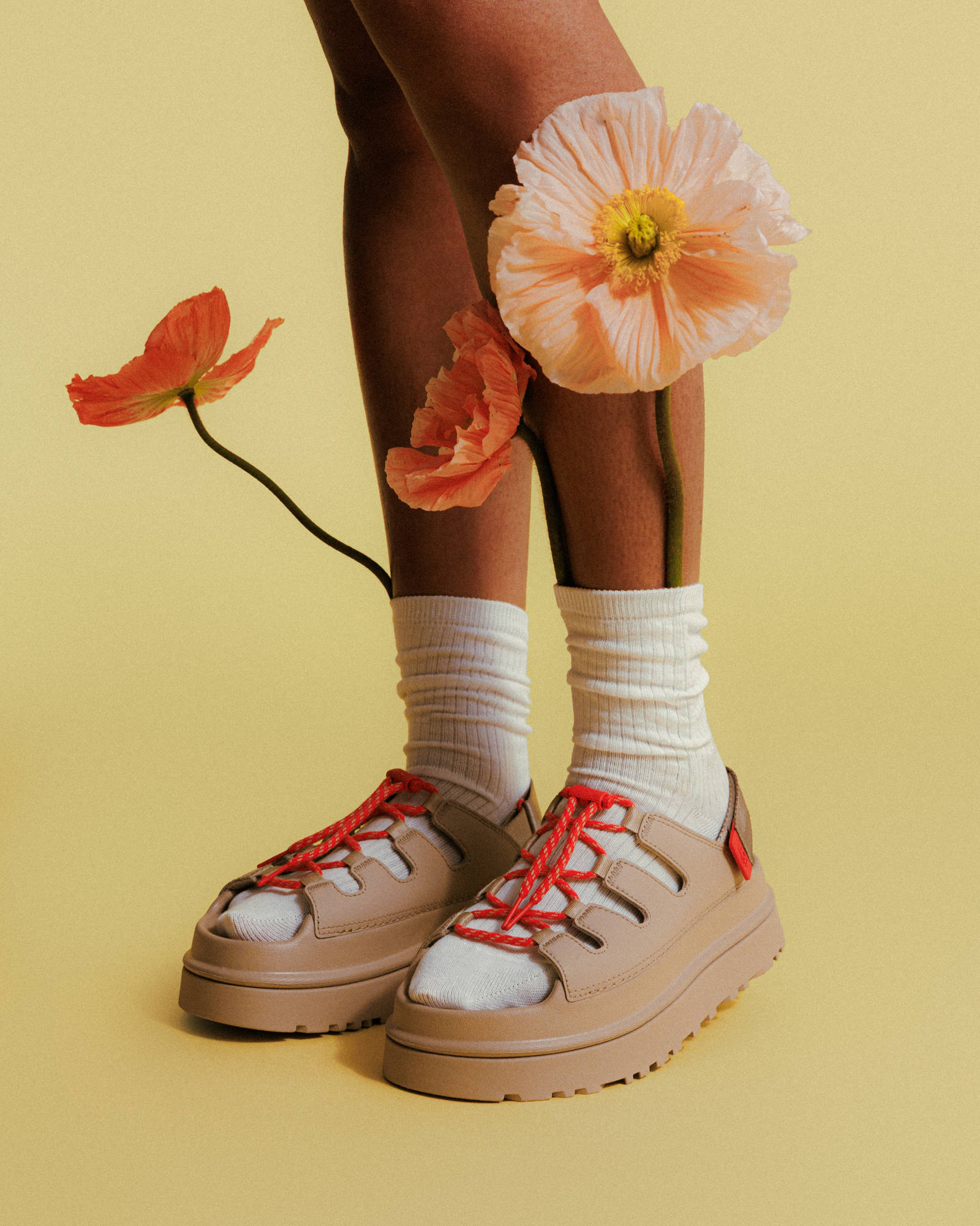 ugg goldenglow toggle on feet with flowers tucked in sock