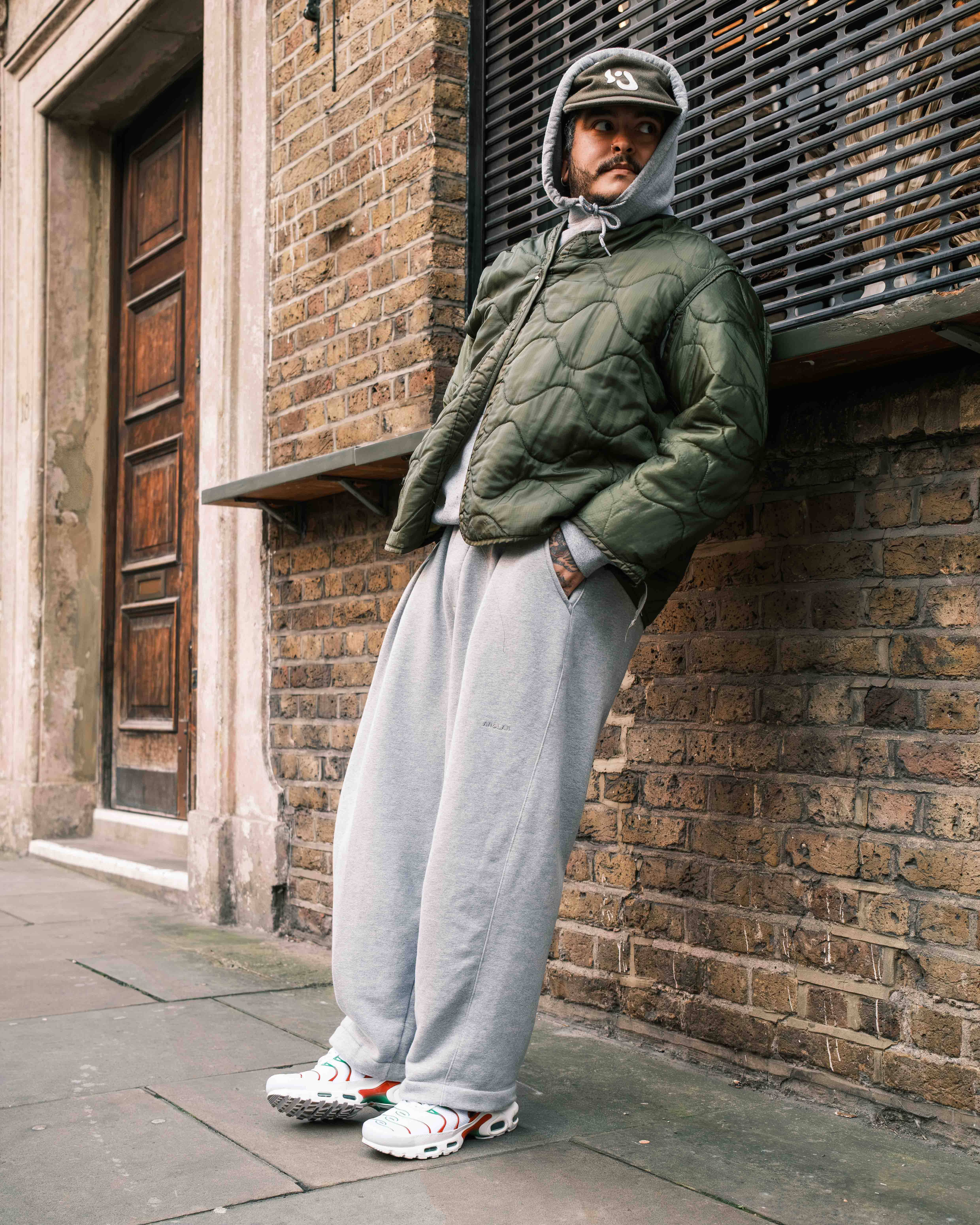 cropped olive bomber and tracksuit pants with tn italy styled editorial