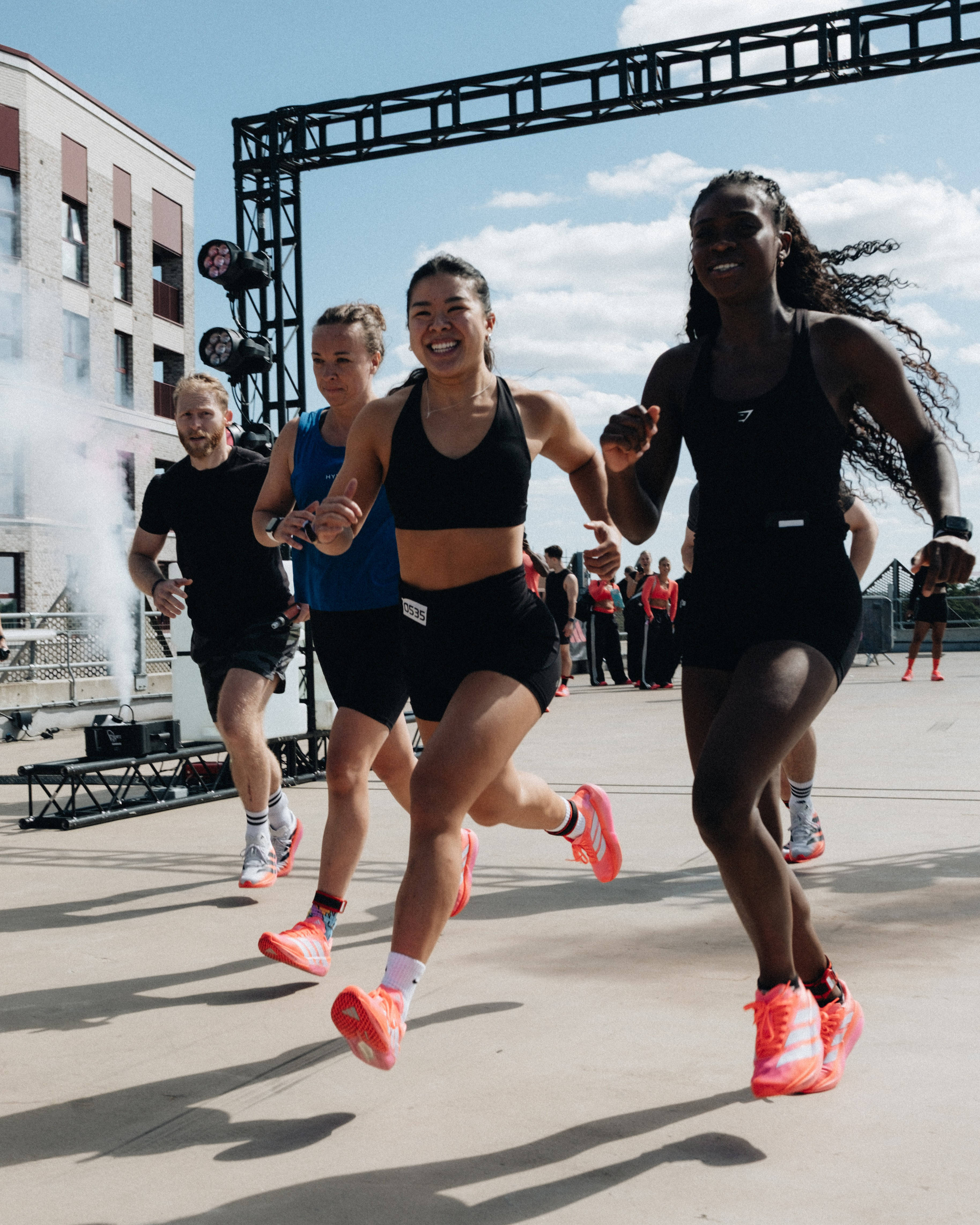 adidas adizero worn by female athletes mid sprint shot editorial