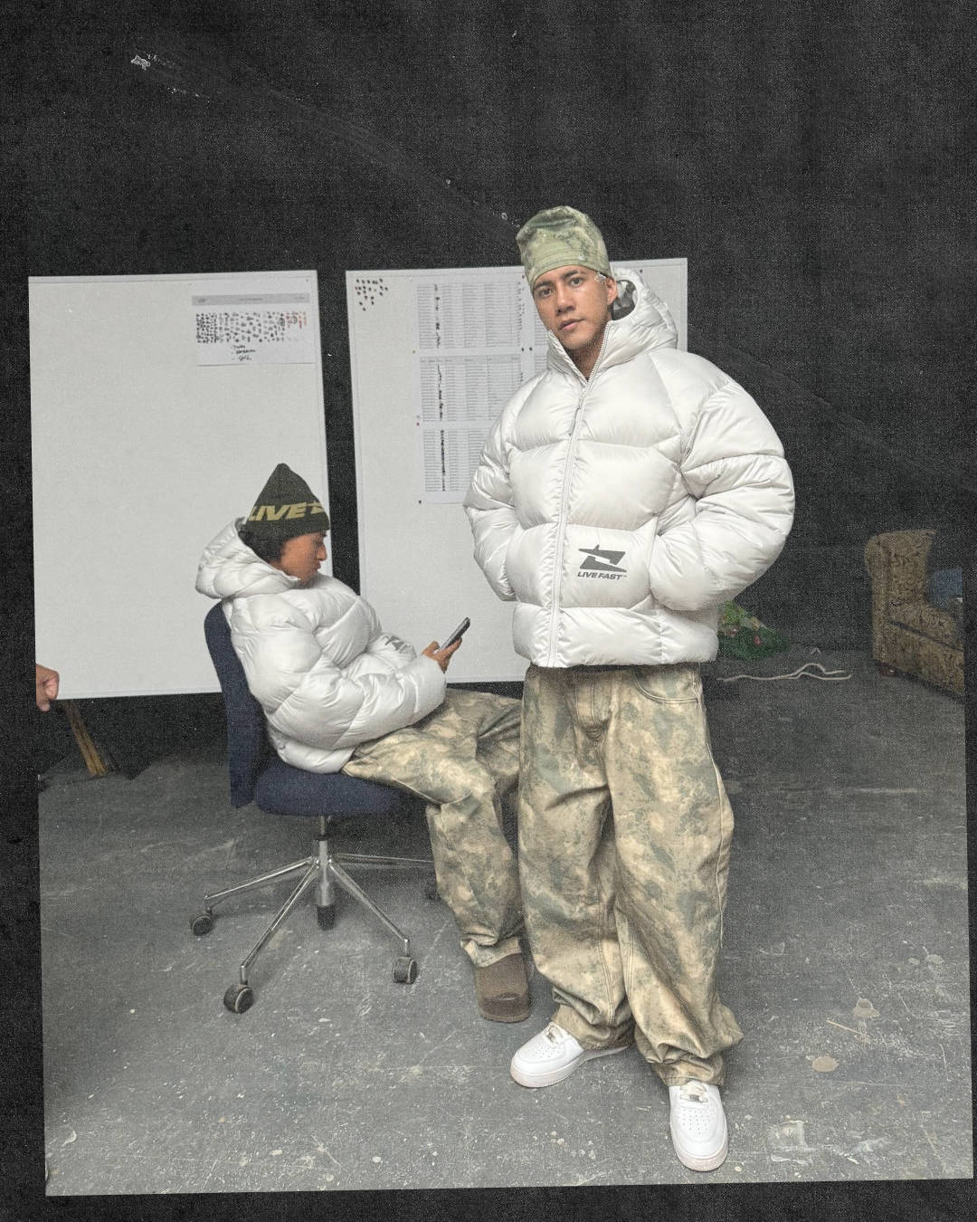 uk streetwear guy dressed in puffer coat and military pants wearing air force 1 white on white