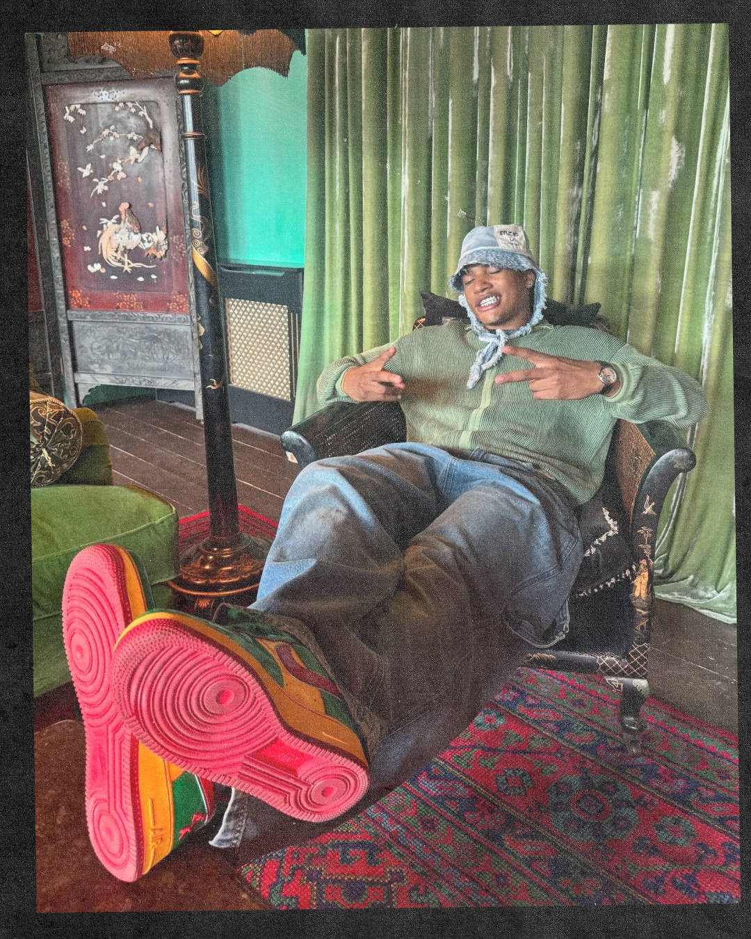 antslive wearing lil yatchty air force 1 while sat back on desk chair with grin throwing up duces