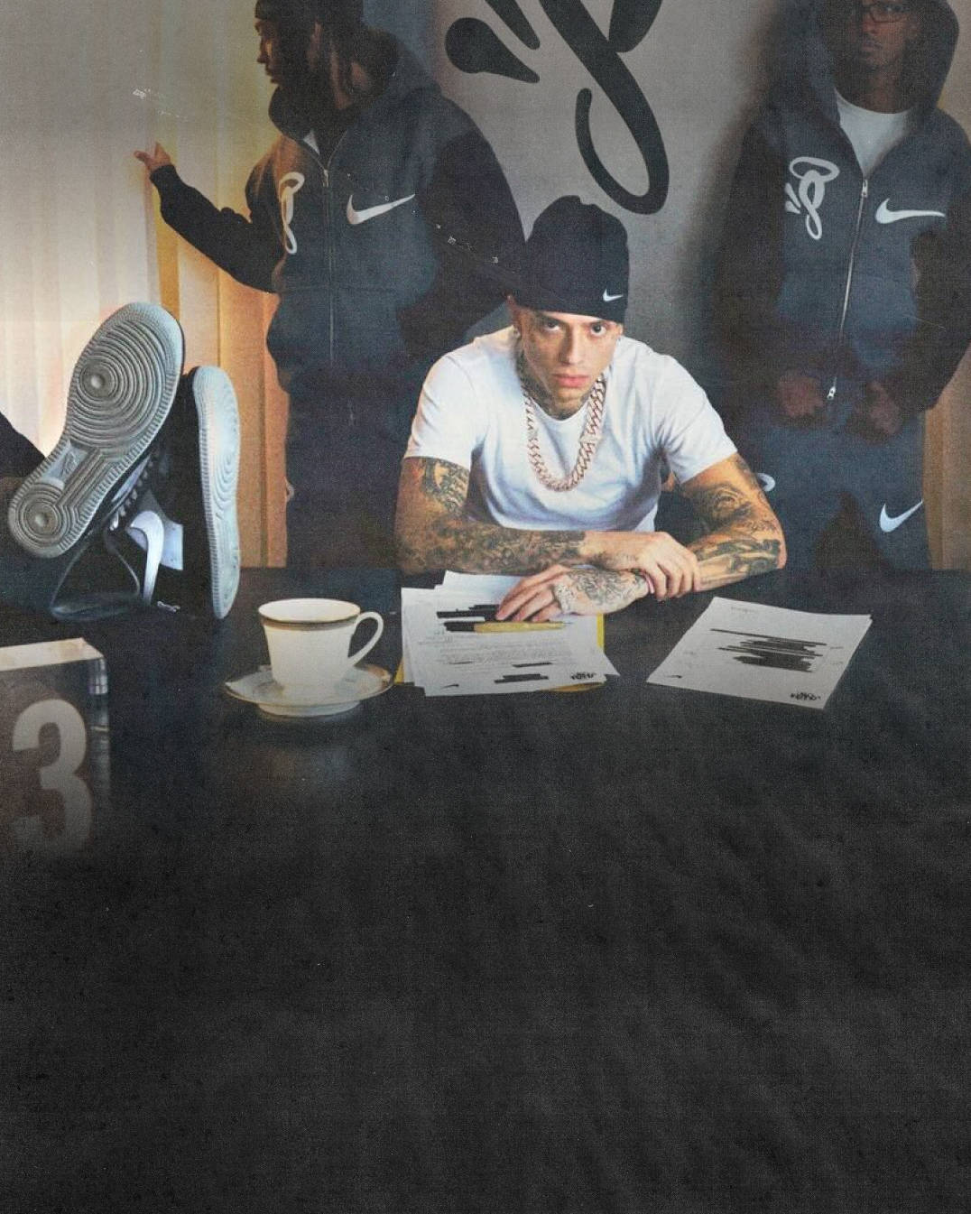 central cee at the boardroom table with air force 1 next to him