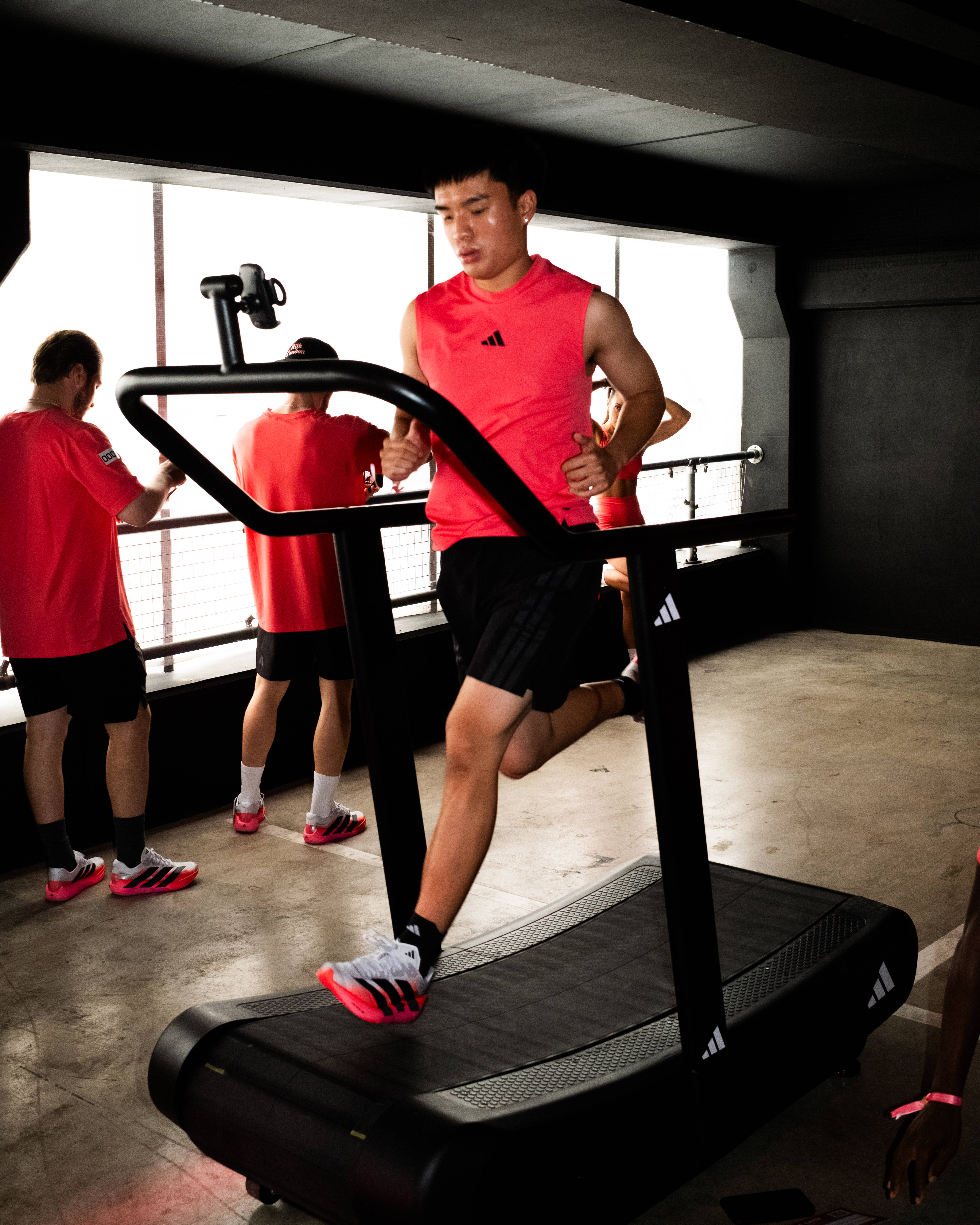 hybrid athlete male running on treadmill during adidas hybrid active event