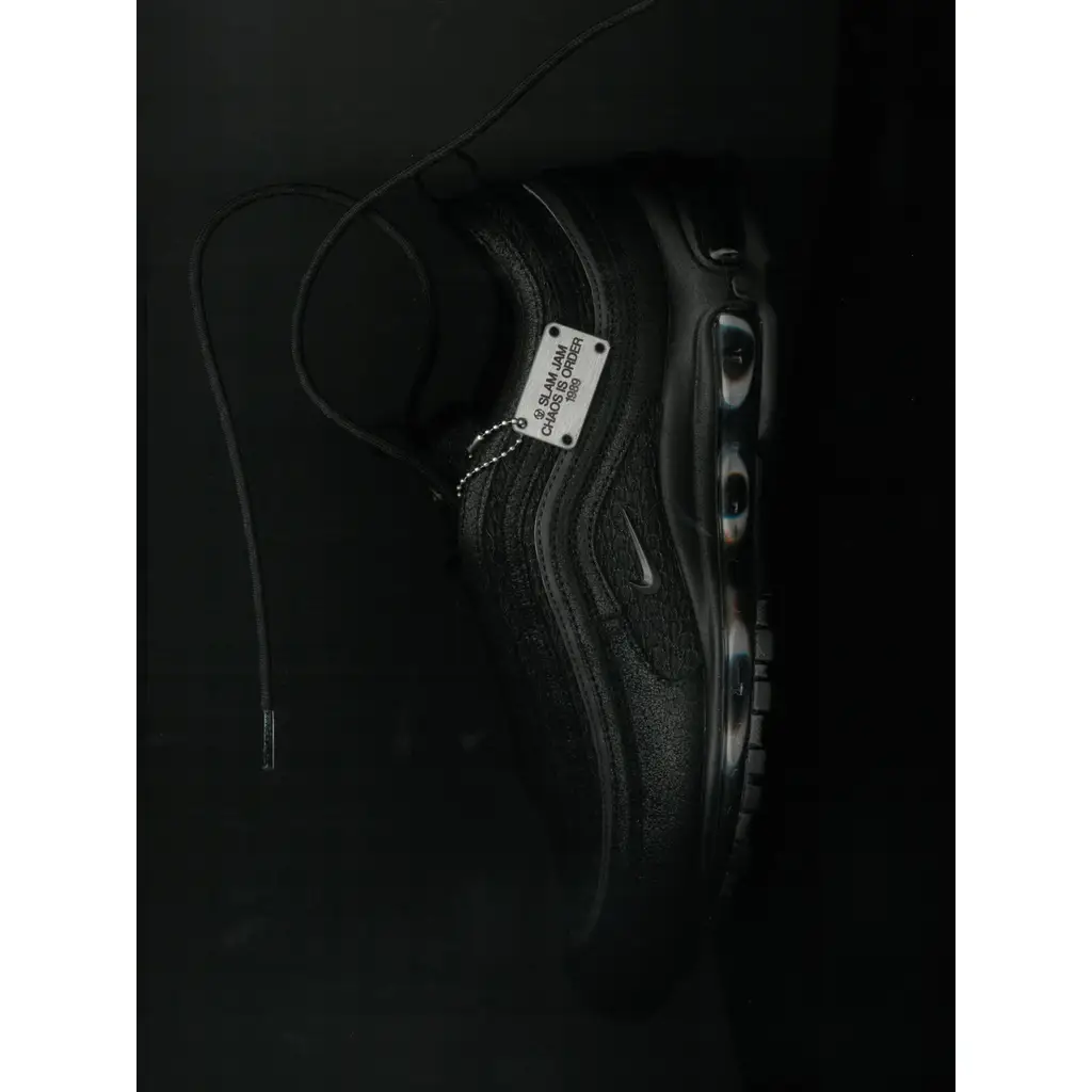 Slam Jam x Nike Air Max 97 Black teaser detail showing darkened Air unit with white eye graphic markings and granular midsole finish